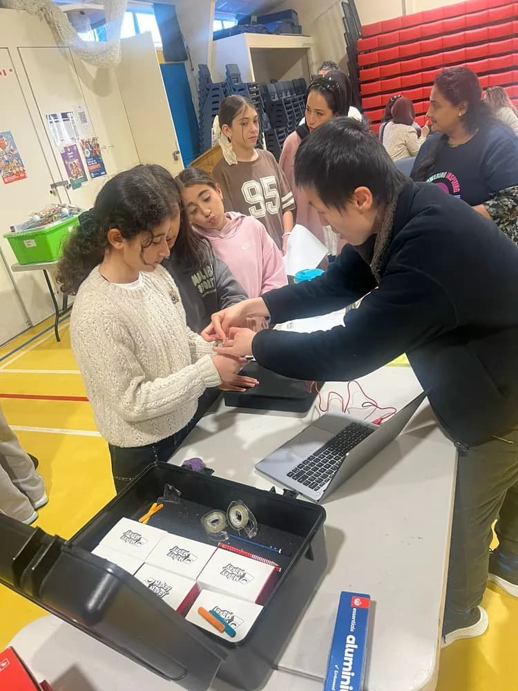Young participants taking part in a hands-on electronics activity