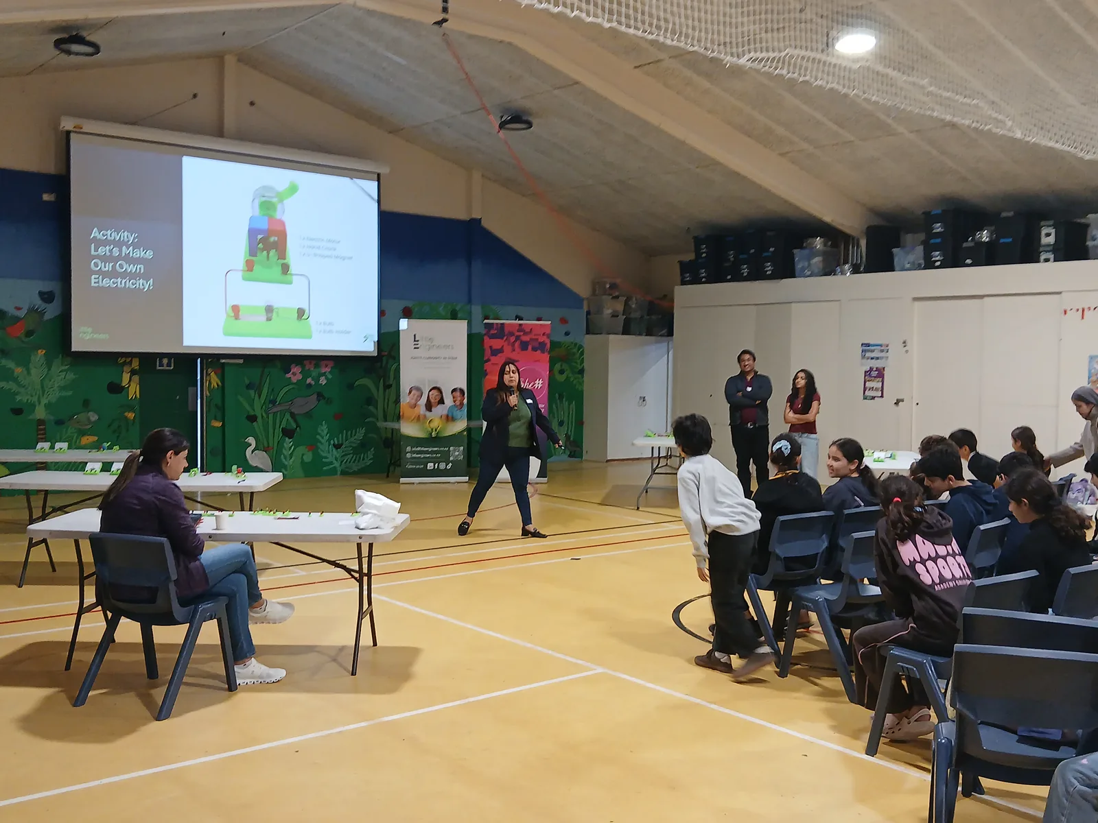 The school hall set up for the Youth Tech Series Electronics Workshop, with the SheSharp welcome screen at the front