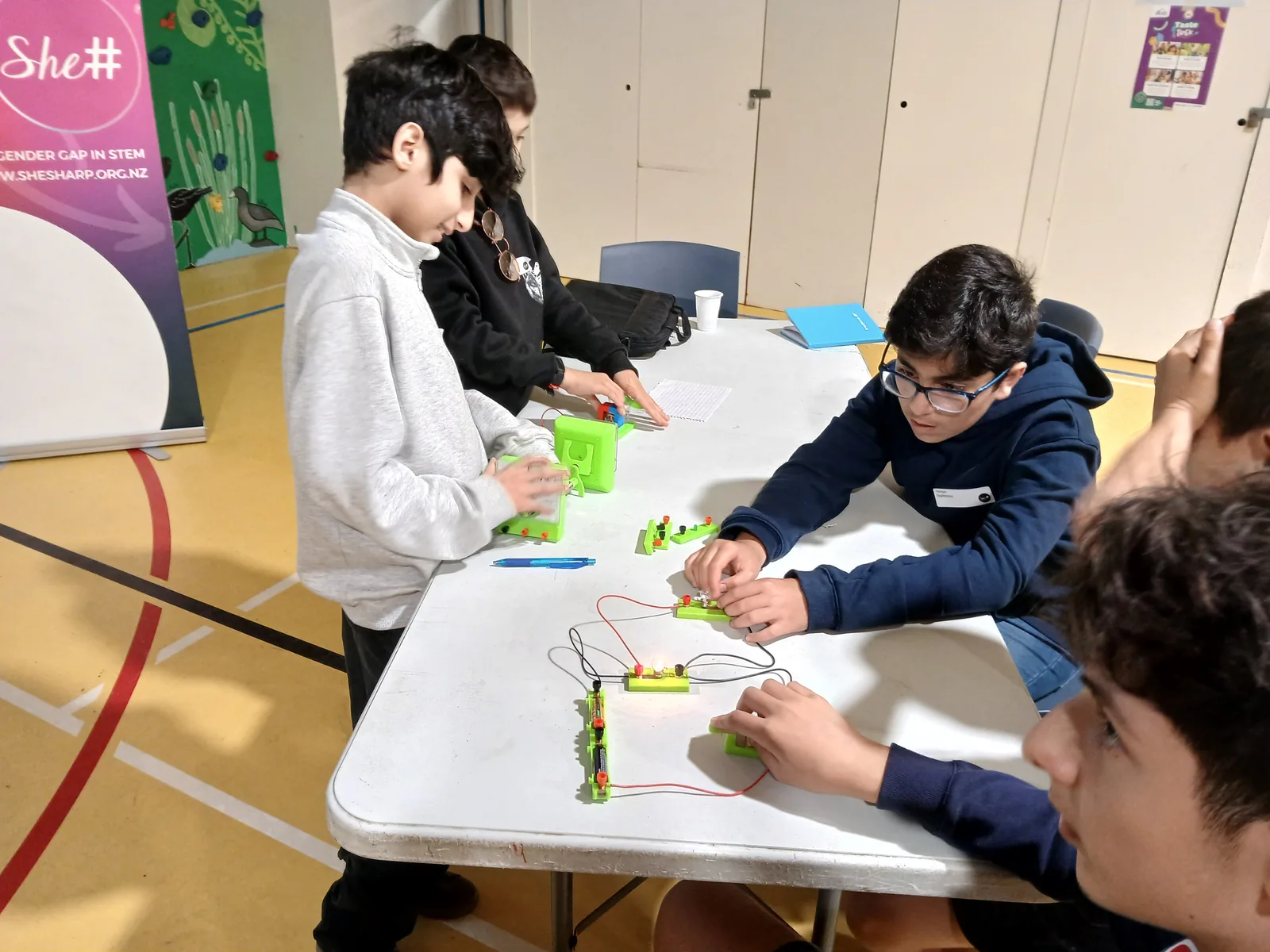 A participant building a circuit during the hands-on electronics workshop