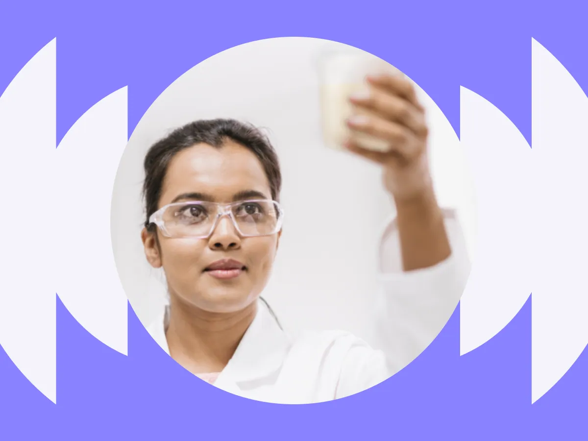 Women scientist standing with arms crossed in a lab